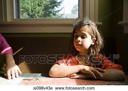 Stock Image - Two girls, one wearing tiara. Fotosearch