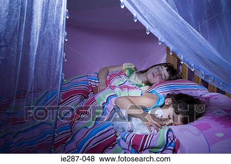 Stock Photo - Two girls sleeping. Fotosearch