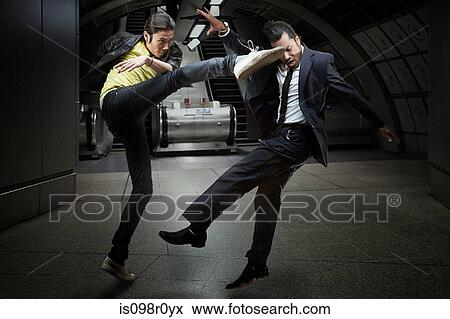 Stock Photo - Two men fighting. Fotosearch