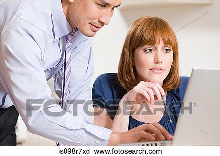 Stock Image - Two office colleagues. Fotosearch