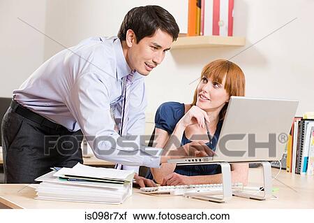 Two office colleagues View Large Photo Image Stock Image - Two office colleagues. Fotosearch