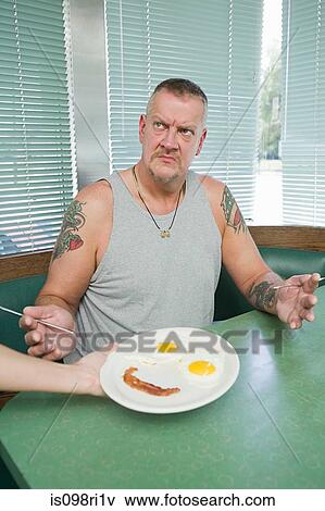 Waiter serving an angry man View Large Photo Image Stock Photo - Waiter serving an angry man. Fotosearch
