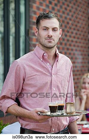 Waiter with espresso coffees View Large Photo Image Stock Image - Waiter with espresso coffees. Fotosearch