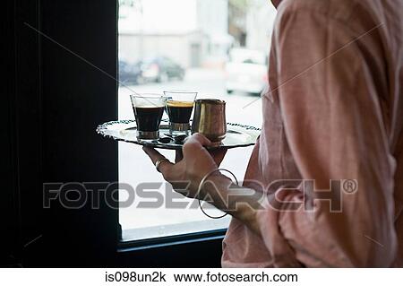 Stock Image - Waiter with espresso. Fotosearch