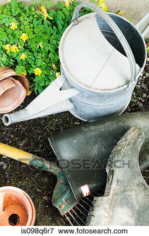 Watering can in garden View Large Photo Image Stock Photo - Watering can in garden. Fotosearch