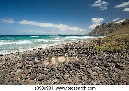 Wind shelter on Playa de Famara, Lanzarote View Large Photo Image Stock Image - Wind shelter on Playa de Famara, Lanzarote. Fotosearch