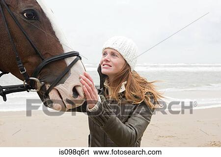 Stock Photograph - Woman and horse. Fotosearch