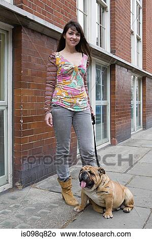 Woman and pet bulldog View Large Photo Image Picture - Woman and pet bulldog. Fotosearch
