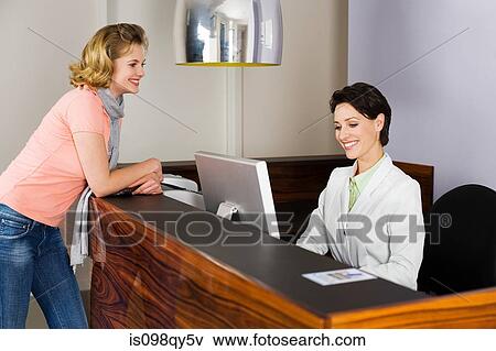 Woman at dental surgery reception View Large Photo Image Stock Photo - Woman at dental surgery reception. Fotosearch