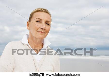 Stock Photograph - Woman at the beach. Fotosearch