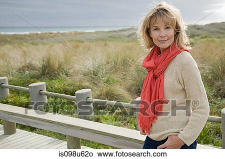 Woman at the coast View Large Photo Image Picture - Woman at the coast. Fotosearch