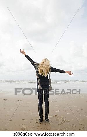 Woman at the coast View Large Photo Image Stock Photo - Woman at the coast. Fotosearch