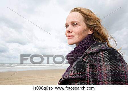 Stock Photography - Woman at the coast. Fotosearch