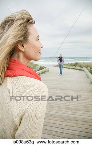 Woman at the coast View Large Photo Image Stock Photography - Woman at the coast. Fotosearch