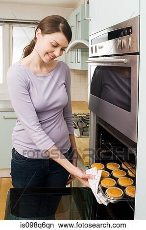Picture - Woman baking cakes. Fotosearch
