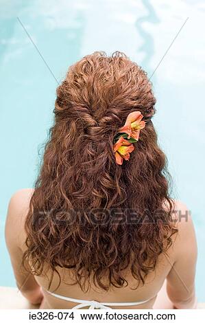 Picture - Woman by swimming pool. Fotosearch
