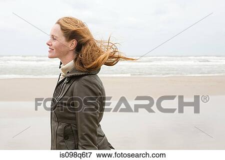 Stock Photo - Woman by the sea. Fotosearch
