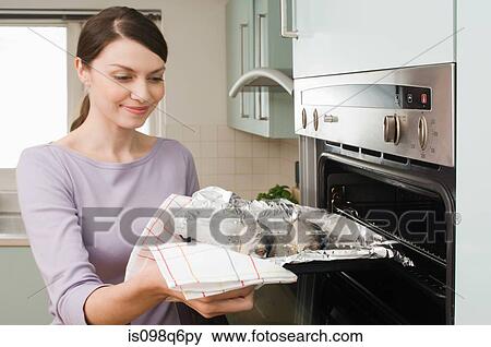 Woman cooking fish View Large Photo Image Stock Photo - Woman cooking fish. Fotosearch