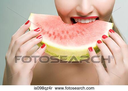 Woman eating watermelon View Large Photo Image Stock Photography - Woman eating watermelon. Fotosearch