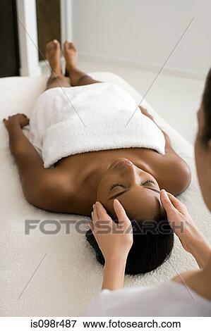 Stock Photo - Woman having a head massage. Fotosearch