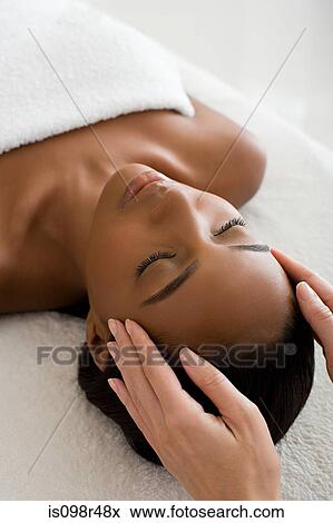 Woman having a head massage View Large Photo Image Stock Photo - Woman having a head massage. Fotosearch