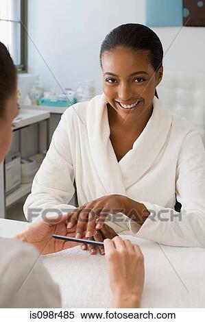 Woman having a manicure View Large Photo Image Stock Photography - Woman having a manicure. Fotosearch