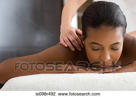 Woman having a massage View Large Photo Image Stock Image - Woman having a massage. Fotosearch