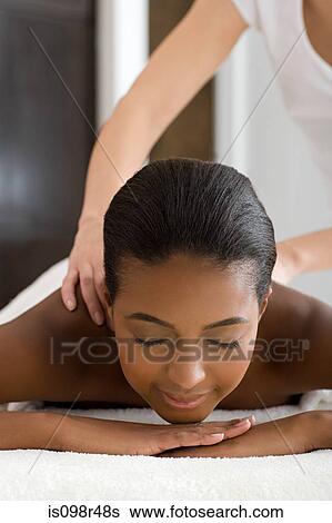 Woman having a massage View Large Photo Image Stock Photograph - Woman having a massage. Fotosearch
