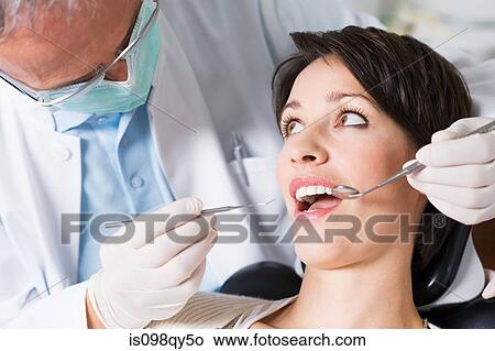Woman having dental check up View Large Photo Image Picture - Woman having dental check up. Fotosearch
