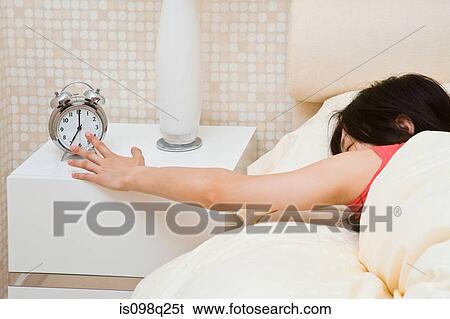 Stock Photograph - Woman in bed. Fotosearch