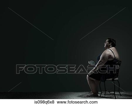 Woman in chair with mirror View Large Photo Image Stock Photo - Woman in chair with mirror. Fotosearch