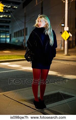 Woman in city at night View Large Photo Image Stock Image - Woman in city at night. Fotosearch