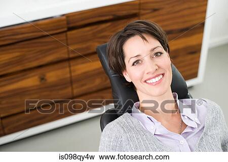 Stock Photo - Woman in dentists chair. Fotosearch