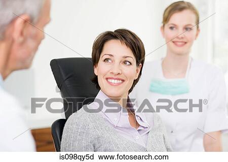 Stock Image - Woman in dentists office. Fotosearch