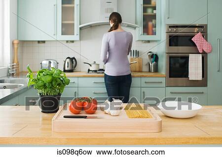 Stock Photo - Woman in kitchen. Fotosearch