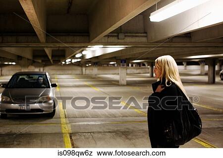 Stock Photo - Woman in parking lot. Fotosearch