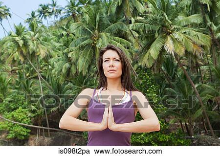 Woman in prayer pose View Large Photo Image Stock Image - Woman in prayer pose. Fotosearch