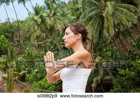 Woman in prayer pose View Large Photo Image Stock Photo - Woman in prayer pose. Fotosearch
