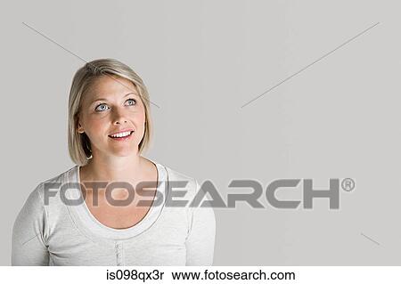 Stock Photography - Woman looking up. Fotosearch