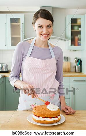 Woman making a cake View Large Photo Image Stock Image - Woman making a cake. Fotosearch