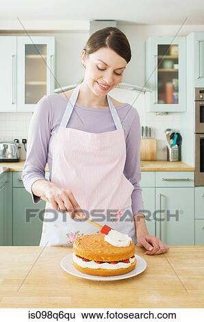 Woman making a cake View Large Photo Image Stock Photograph - Woman making a cake. Fotosearch