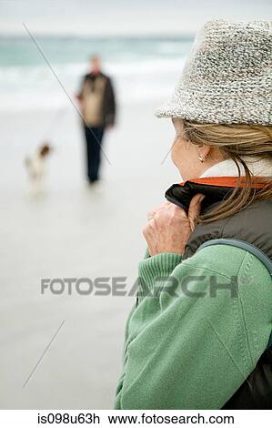 Woman on a beach View Large Photo Image Stock Image - Woman on a beach. Fotosearch