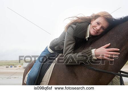 Woman on horse View Large Photo Image Stock Image - Woman on horse. Fotosearch