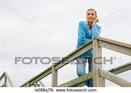 Stock Image - Woman outdoors. Fotosearch