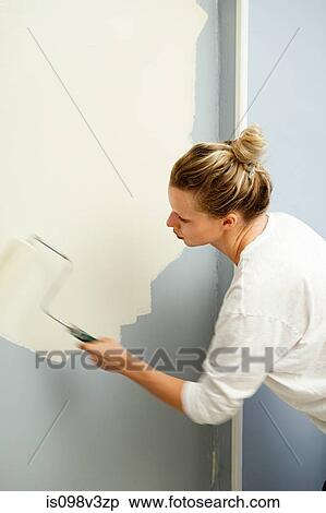 Woman painting wall View Large Photo Image Stock Photography - Woman painting wall. Fotosearch