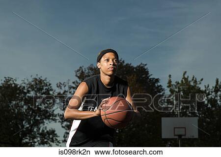 Woman playing basketball View Large Photo Image Picture - Woman playing basketball. Fotosearch