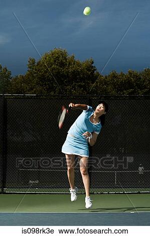Woman playing tennis View Large Photo Image Stock Image - Woman playing tennis. Fotosearch