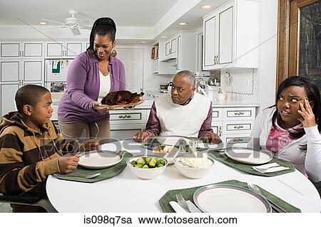 Stock Image - Woman serving burned turkey. Fotosearch