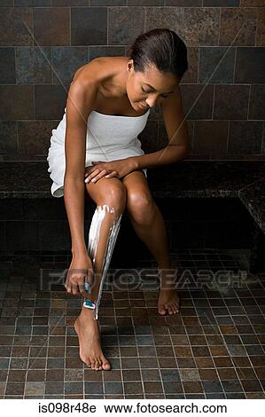 Woman shaving legs View Large Photo Image Stock Image - Woman shaving legs. Fotosearch