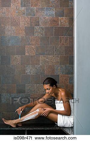 Woman shaving legs View Large Photo Image Stock Photograph - Woman shaving legs. Fotosearch